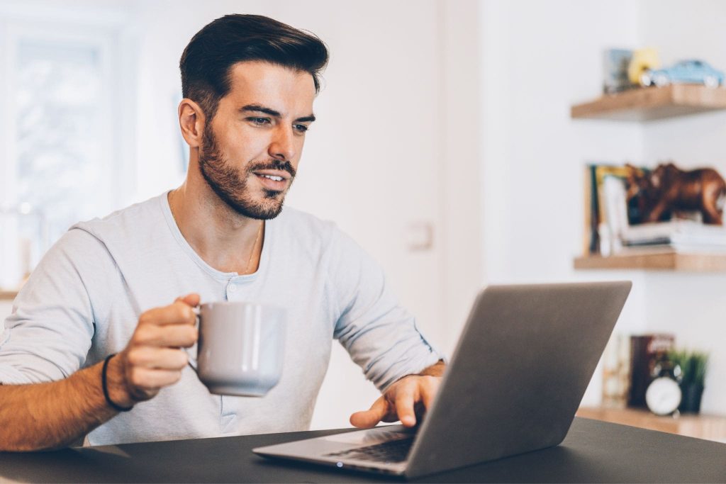A self-employed borrower reviewing financial documents, representing the manual underwriting and bank-statement structure used in a $4.29M super jumbo mortgage approval